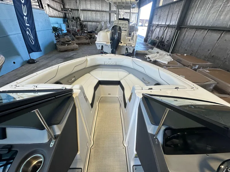 Slide: The Image of 2025 Regal LX2 boat dashboard with sleek steering wheel and modern controls. - 14