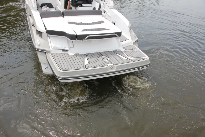 Slide: The Image of 2021 Monterey 298 SS boat on calm water, showcasing sleek design and modern features. - 15