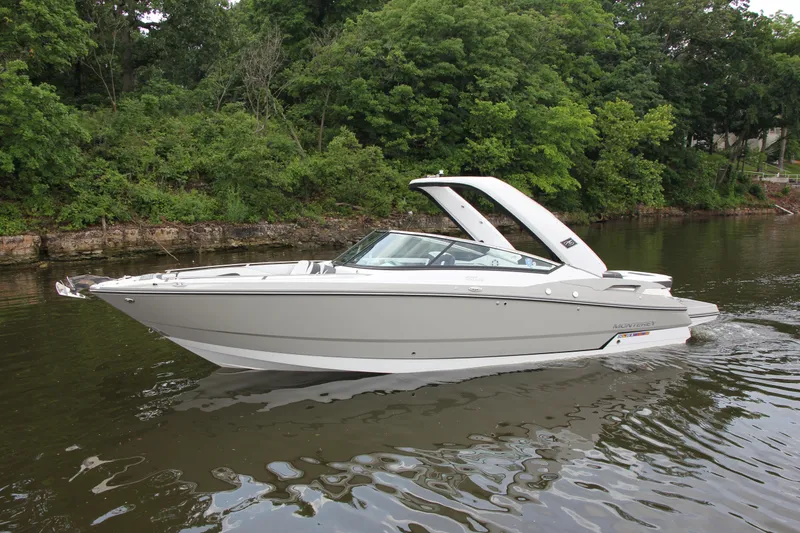 Slide: The Image of 2021 Monterey 298SS Super Sport boat with sleek white and black seating design. - 6