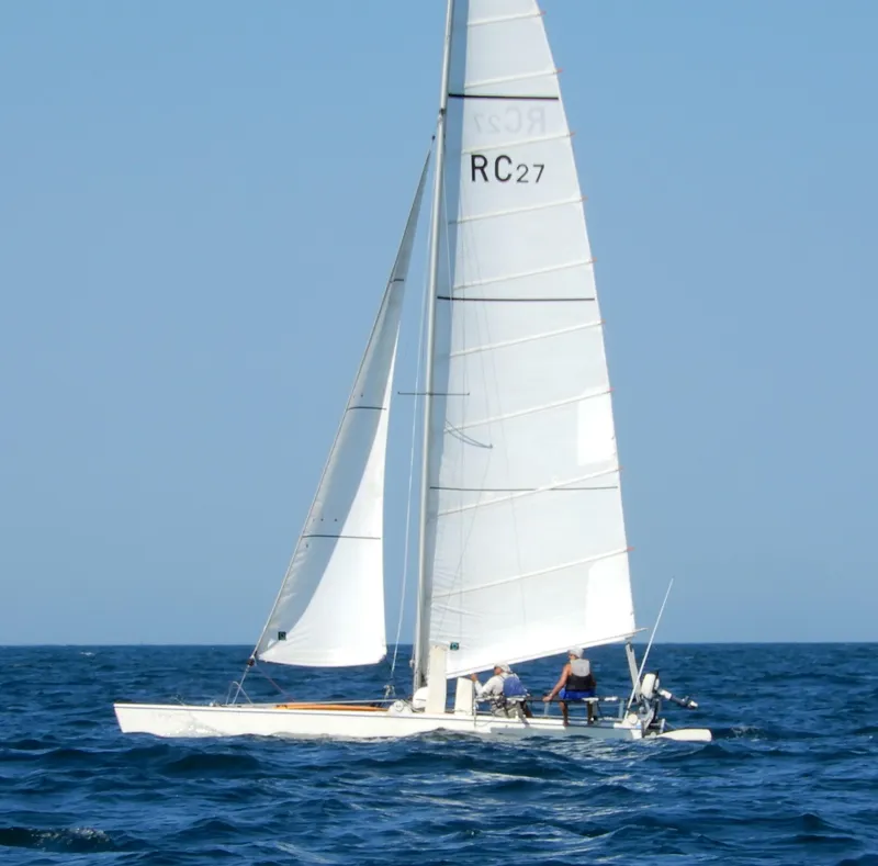 The Image of Sailboat Aquarius RC 27, 1981 model, sailing on open sea under clear blue sky. - 0