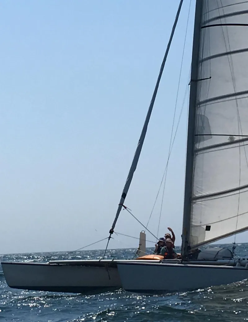 Slide: The Image of Sailboat Aquarius RC 27, 1981 model, gliding on the ocean under clear skies. - 4