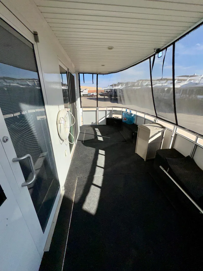 Slide: The Image of Covered deck area on Adonia houseboat, model "Just Add Water Trip #13," 2021. - 17