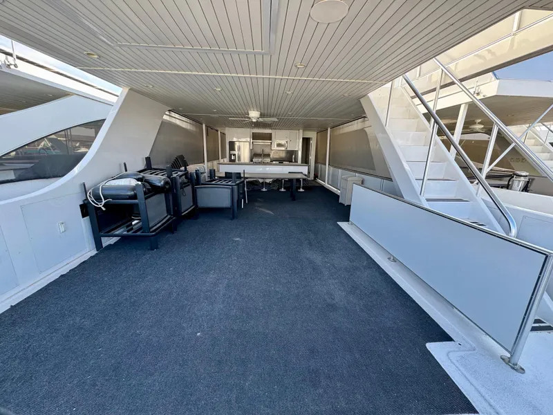 Slide: The Image of Spacious deck area on Adonia Just Add Water Trip #13, featuring grills and seating, 2021 model. - 26