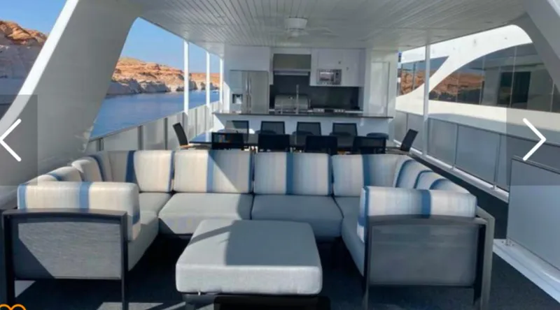 Slide: The Image of Luxurious Adonia Just Add Water Trip 13 houseboat interior with modern seating and kitchen, 2021 model. - 27