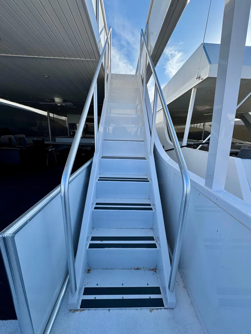 Slide: The Image of White metal staircase on Adonia's "Just Add Water Trip #13" boat, 2021 model. - 28