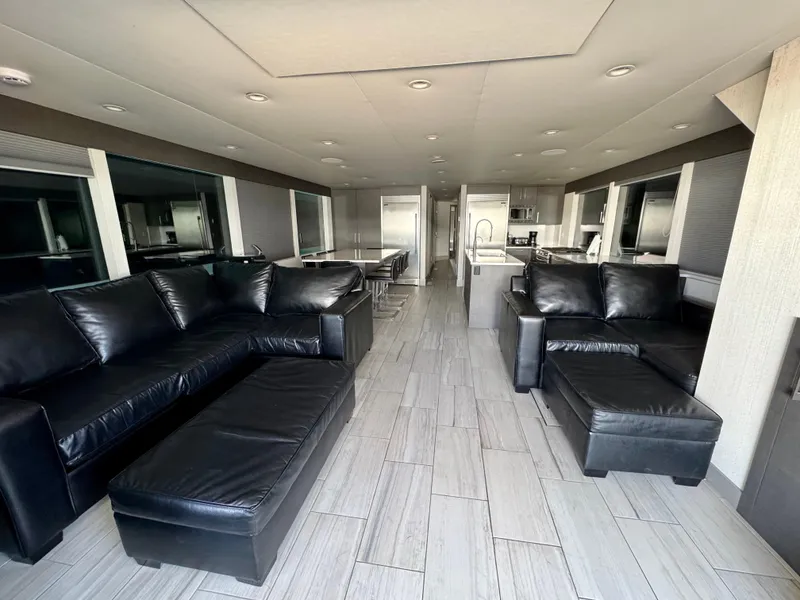 Slide: The Image of Luxurious interior of Adonia Just Add Water Trip #13, 2021, with modern black leather sofas. - 3