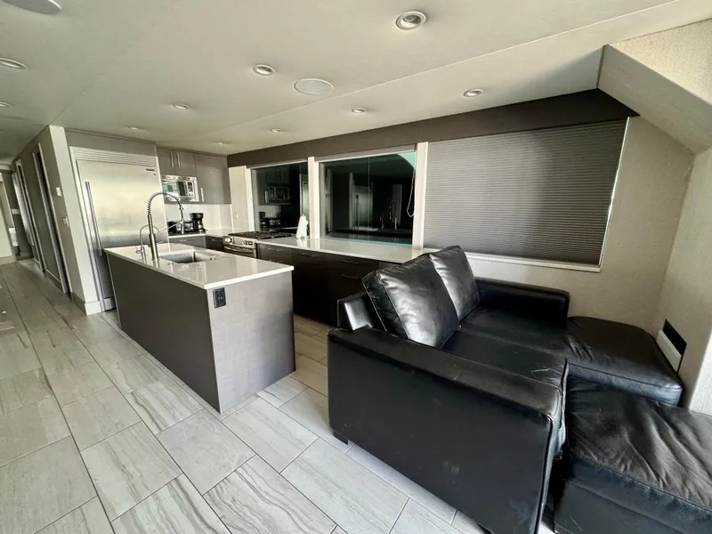 Slide: The Image of Modern kitchen and living area in Adonia's 2021 "Just Add Water Trip #13" model. - 4