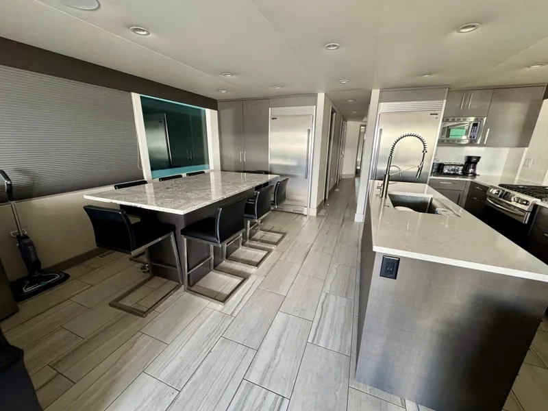 Slide: The Image of Modern kitchen interior with sleek countertops, stainless steel appliances, and stylish seating. Adonia 2021 model. - 5