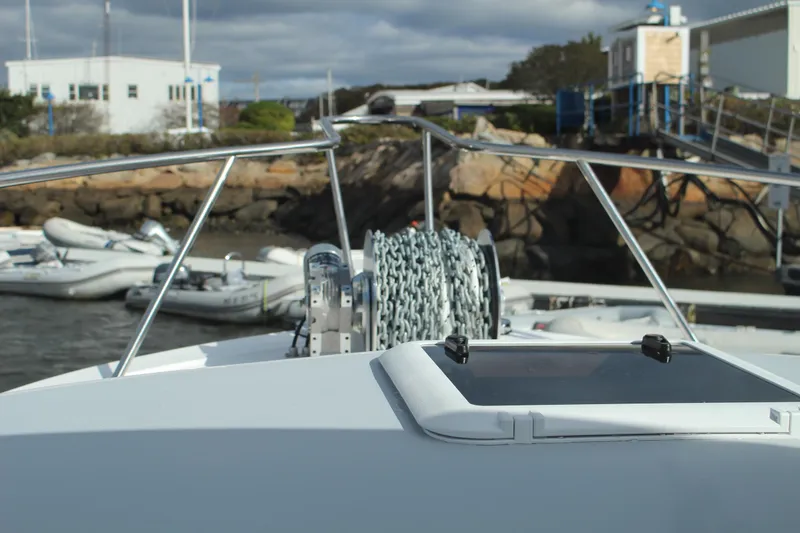 Slide: The Image of Bow of 2024 Steiger Craft 31 Miami at dock with anchor chain. - 11