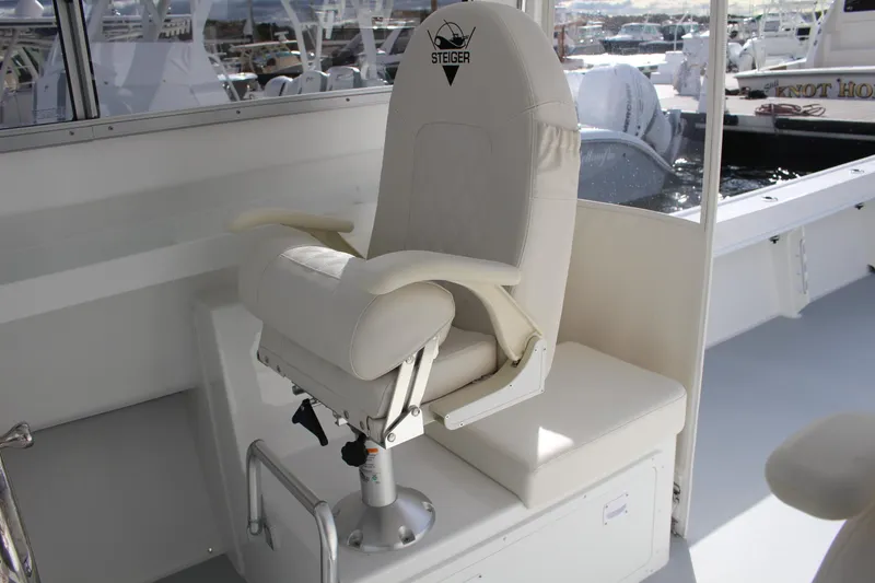 Slide: The Image of Captain's chair on the 2024 Steiger Craft 31 Miami boat. - 17