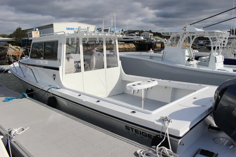 Slide: The Image of 2024 Steiger Craft 31 Miami boat docked at marina. - 2