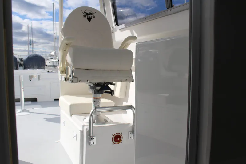 Slide: The Image of 2024 Steiger Craft 31 Miami boat captain's chair with white upholstery. - 21