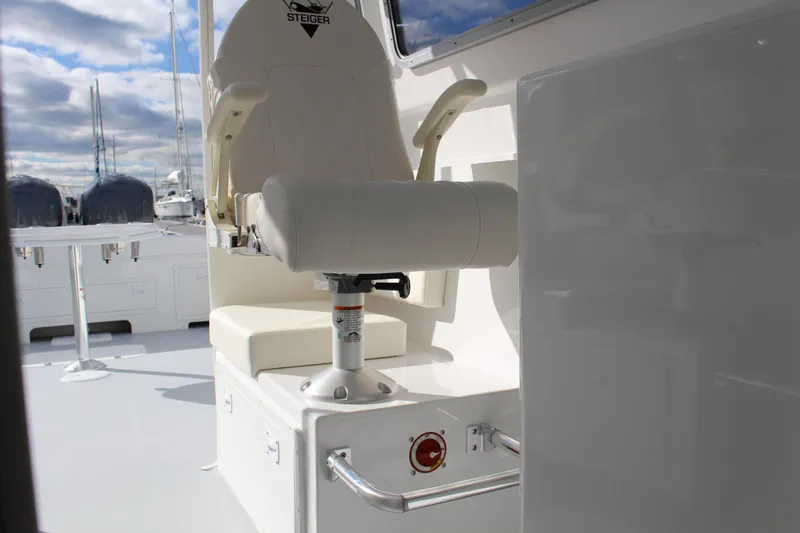 Slide: The Image of 2024 Steiger Craft 31 Miami boat helm seat and deck area. - 22