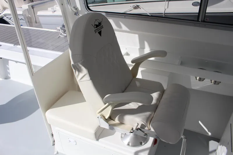 Slide: The Image of 2024 Steiger Craft 31 Miami boat captain's chair in white. - 25