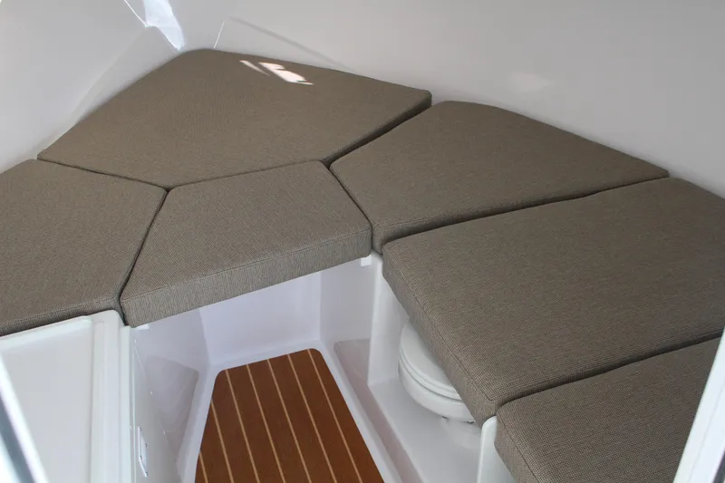 Slide: The Image of 2024 Steiger Craft 31 Miami cabin interior with cushioned seating and wooden flooring. - 32