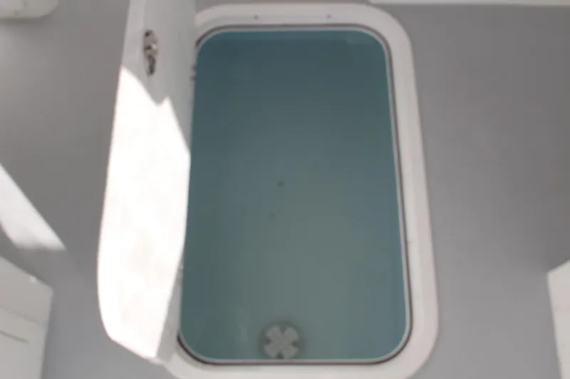 Slide: The Image of Open hatch on 2024 Steiger Craft 31 Miami boat showing storage compartment. - 35