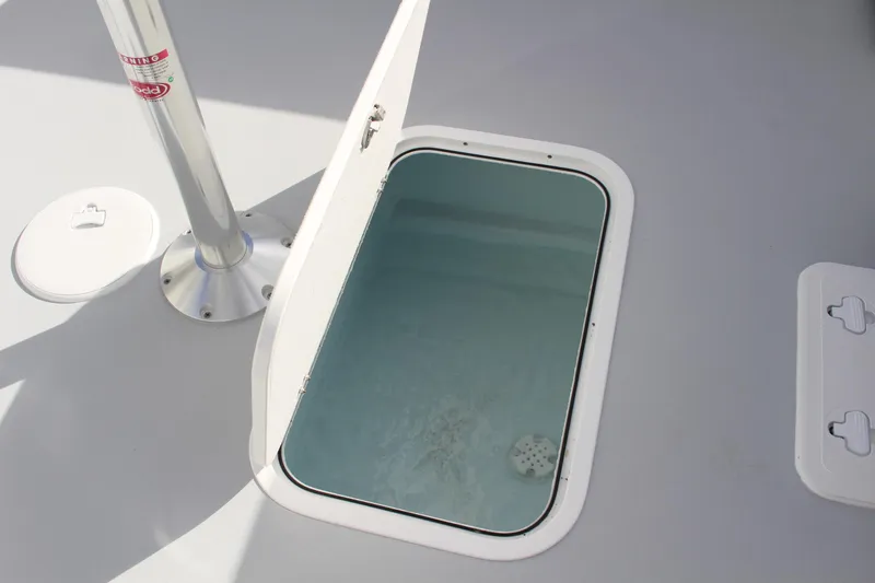 Slide: The Image of 2024 Steiger Craft 31 Miami deck hatch with open storage compartment. - 36