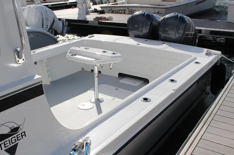 Slide: The Image of 2024 Steiger Craft 31 Miami boat with dual outboard motors at dock. - 4