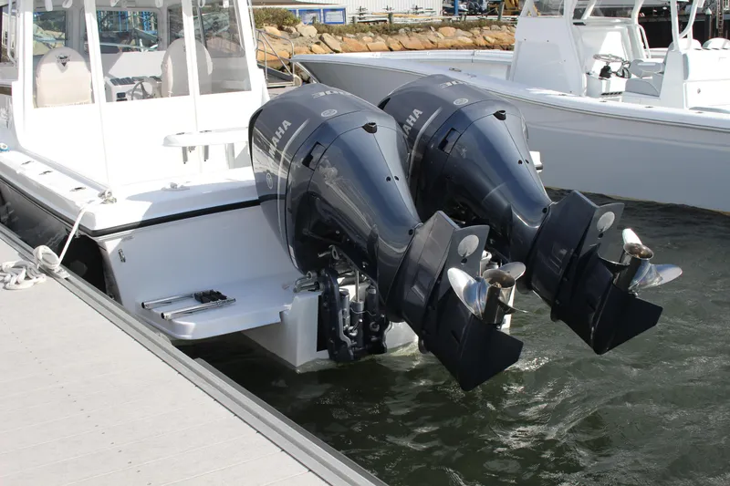 Slide: The Image of 2024 Steiger Craft 31 Miami boat with twin Yamaha outboard engines docked. - 5