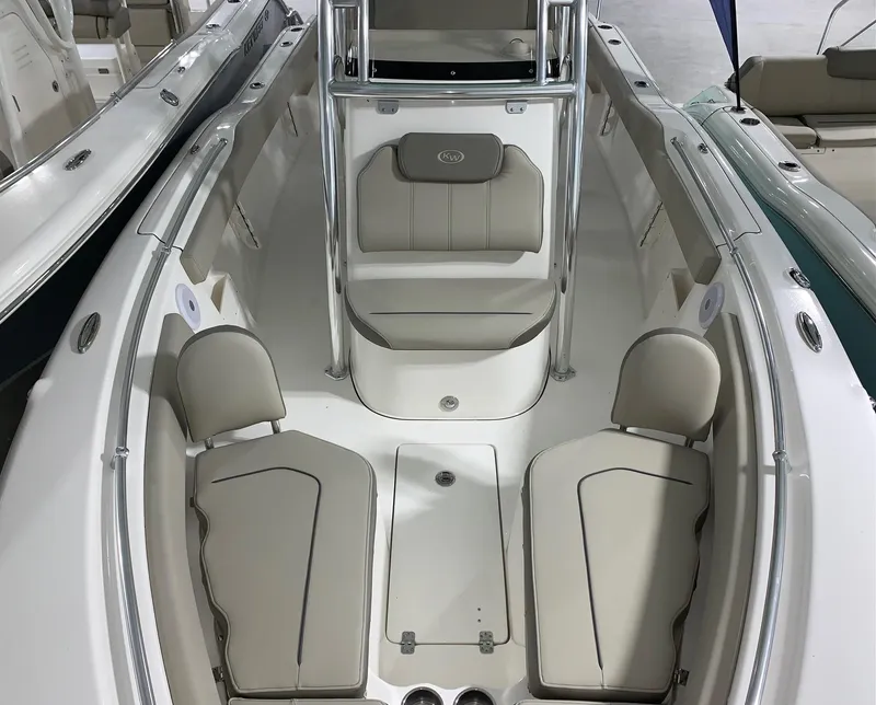 Slide: The Image of 2024 Key West 239 FS boat interior with cushioned seating and storage compartments. - 3