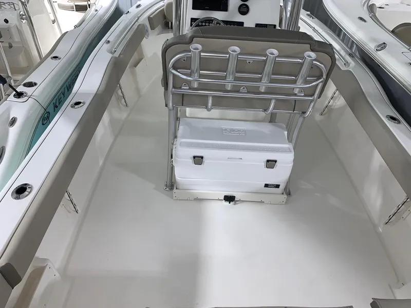 Slide: The Image of 2024 Key West 239 FS boat interior with seating and storage. - 4