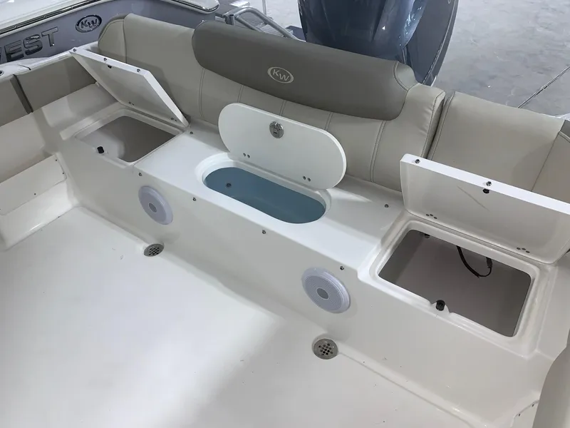Slide: The Image of 2024 Key West 239 FS boat interior with storage compartments and seating. - 11
