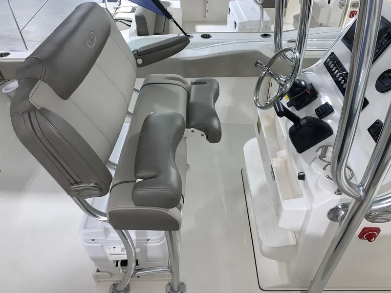 Slide: The Image of 2024 Key West 239 FS boat interior with helm station and seating. - 13