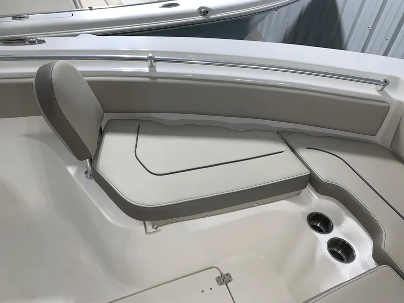 Slide: The Image of 2024 Key West 239 FS boat interior seating with cup holders. - 18