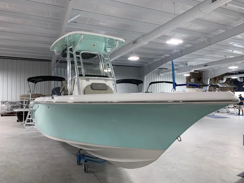 Slide: The Image of 2024 Key West 239 FS boat in a showroom. - 2