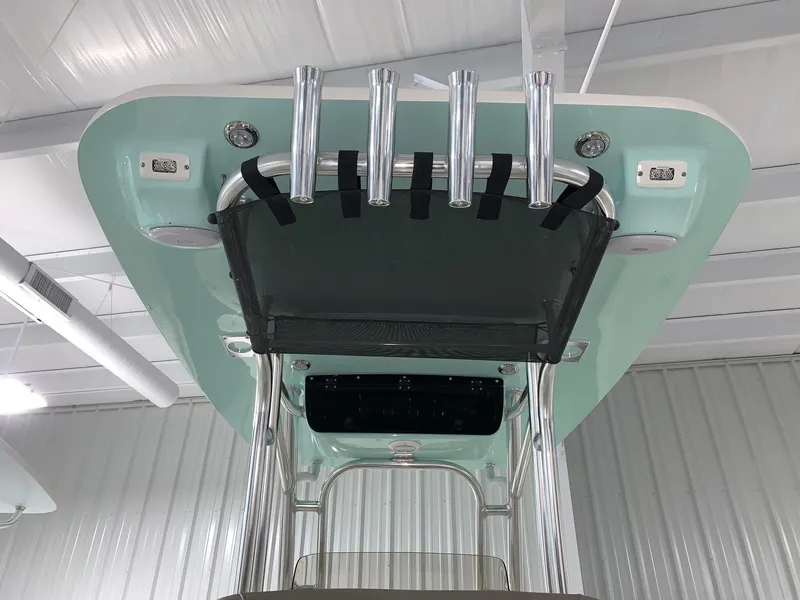 Slide: The Image of 2024 Key West 239 FS boat T-top with rod holders and storage net. - 6