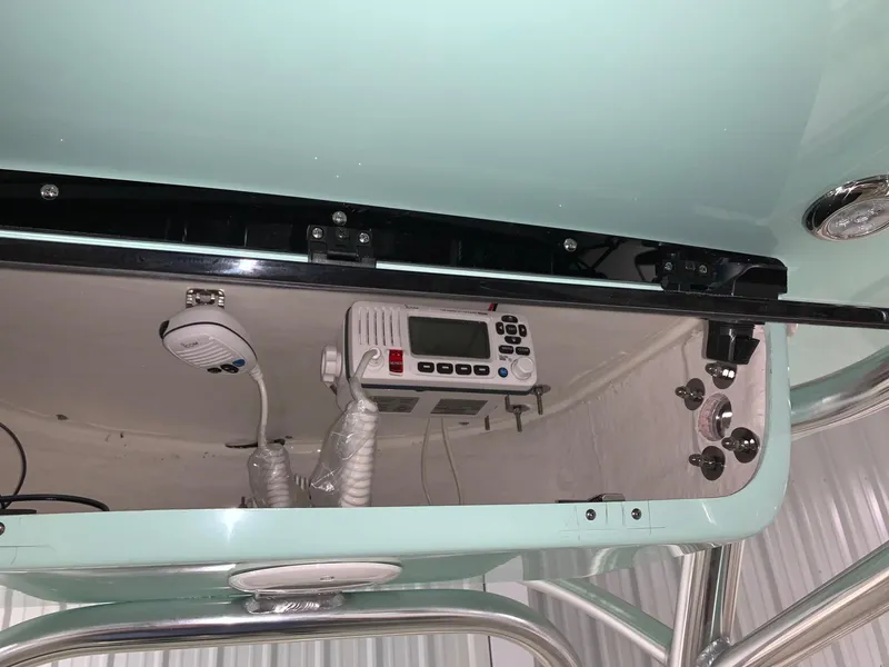 Slide: The Image of 2024 Key West 239 FS boat console with marine radio and controls. - 7