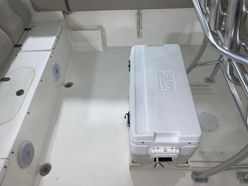Slide: The Image of 2024 Key West 239 FS boat interior with cooler and seating area. - 9