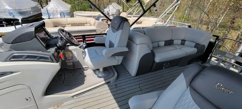 Slide: The Image of 2020 Ranger 2300LS boat interior with captain's chair and spacious seating. - 5