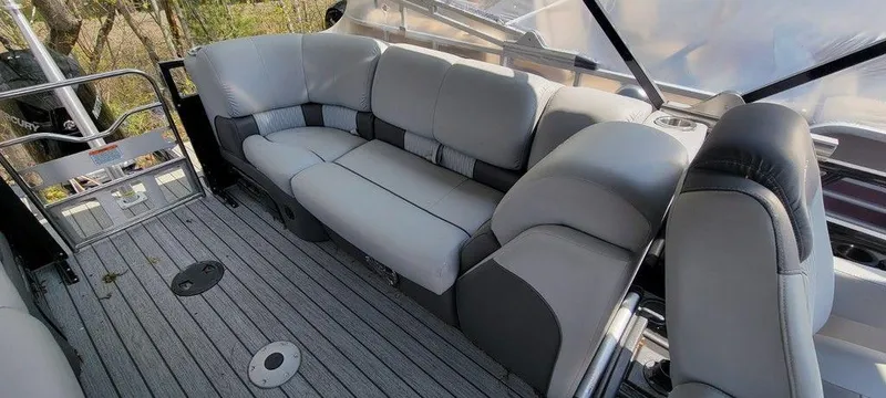 Slide: The Image of 2020 Ranger 2300LS boat interior with gray cushioned seating and deck. - 6