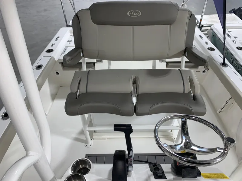 Slide: The Image of 2024 Key West 230 Bay Reef boat helm with dual seats and steering wheel. - 10