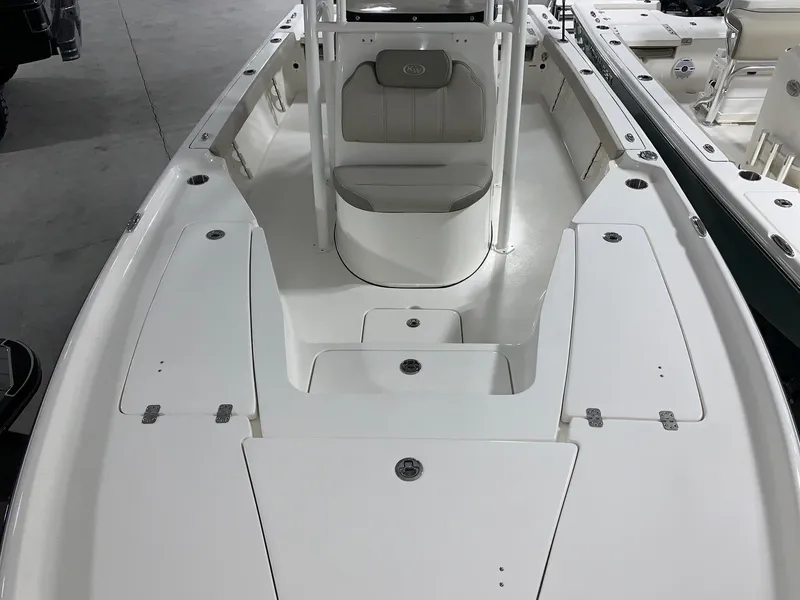 Slide: The Image of 2024 Key West 230 Bay Reef boat interior, white deck and seating. - 14