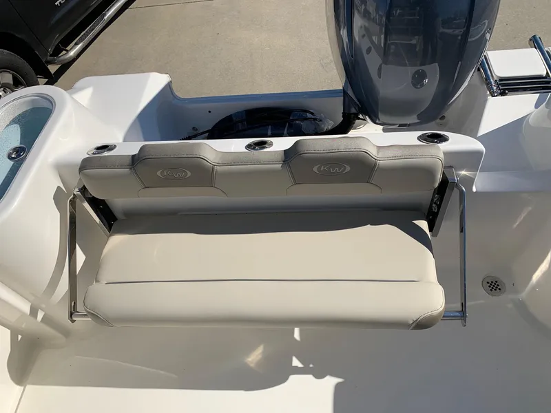 Slide: The Image of 2024 Key West 244 CC boat with rear seating and motor. - 15