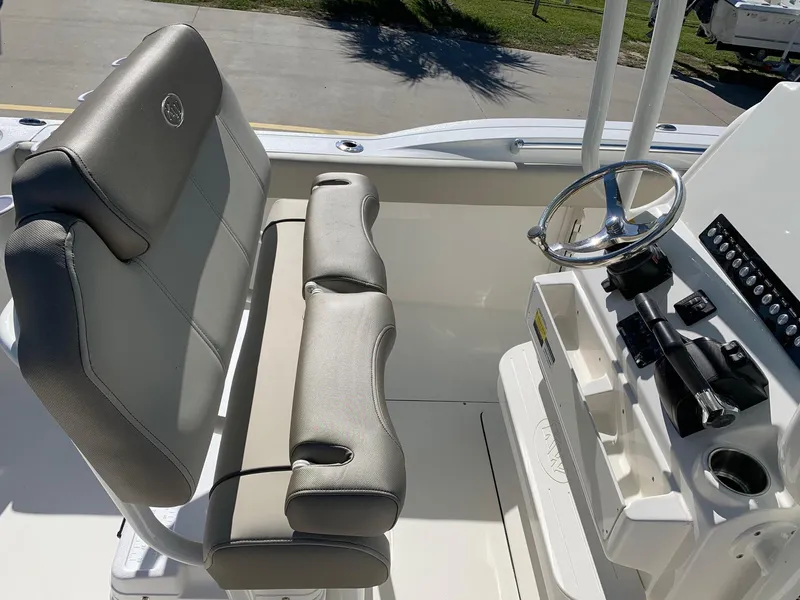 Slide: The Image of 2024 Key West 244 CC boat interior with helm and seating. - 19