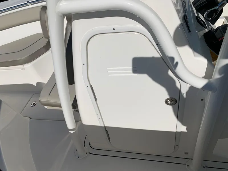 Slide: The Image of 2024 Key West 244 CC boat interior with seating and storage compartment. - 21