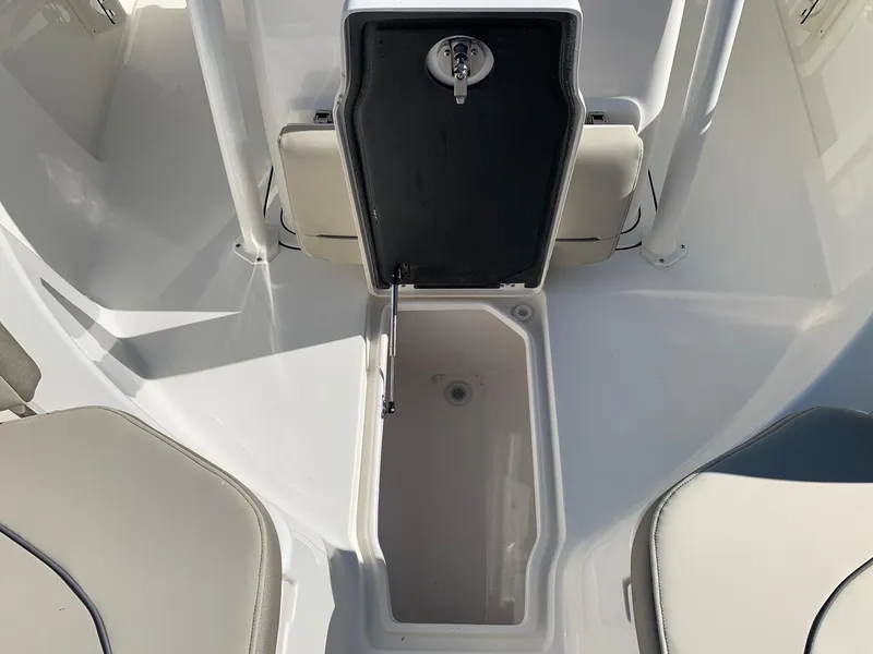 Slide: The Image of 2024 Key West 244 CC boat storage compartment with open hatch. - 22