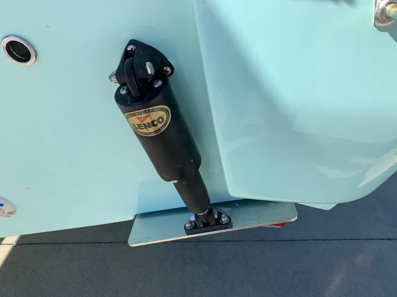 Slide: The Image of Close-up of a 2024 Key West 244 CC boat's trim tab actuator. - 32