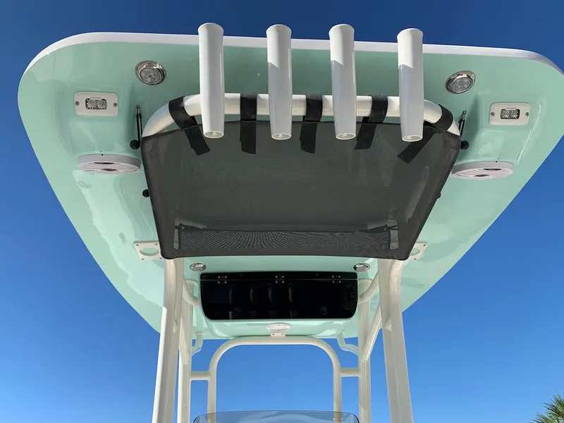 Slide: The Image of 2024 Key West 244 CC boat T-top with rod holders and speakers. - 6