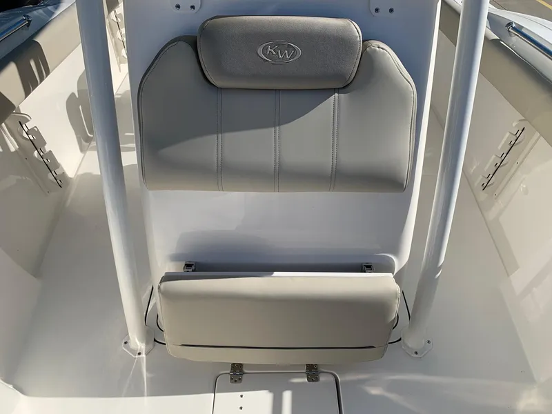 Slide: The Image of 2024 Key West 244 CC boat seating area with cushioned backrest. - 22