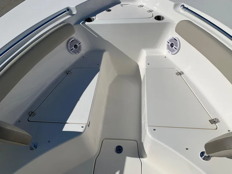 Slide: The Image of 2024 Key West 244 CC boat interior with storage compartments and seating. - 25