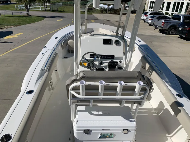 Slide: The Image of 2024 Key West 244 CC center console boat, interior view with helm and seating. - 5