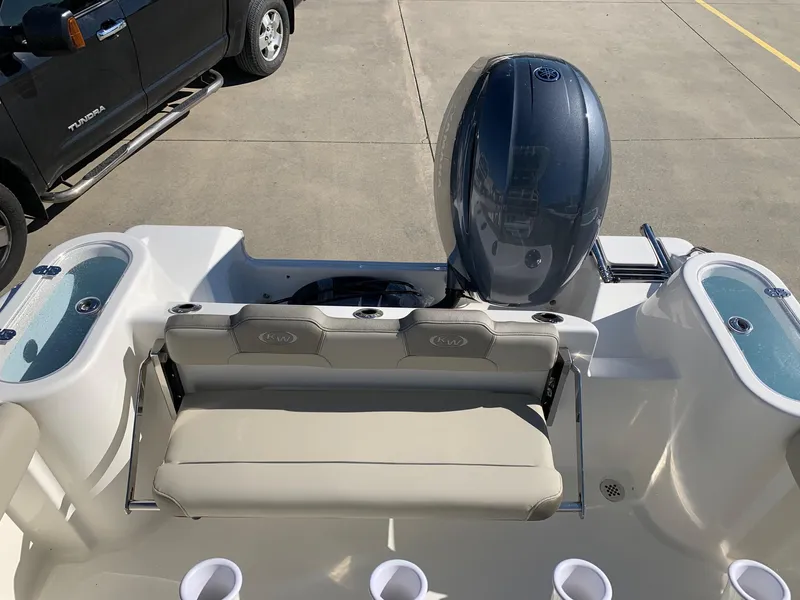 Slide: The Image of 2024 Key West 244 CC boat with rear seating and outboard motor. - 8