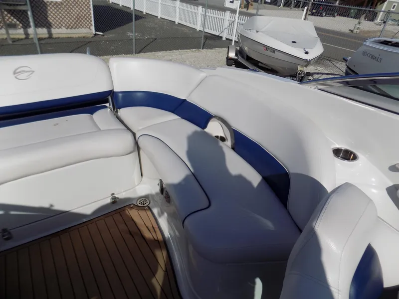 Slide: The Image of 2013 Crownline Eclipse E4 boat interior with white and blue seating. - 10
