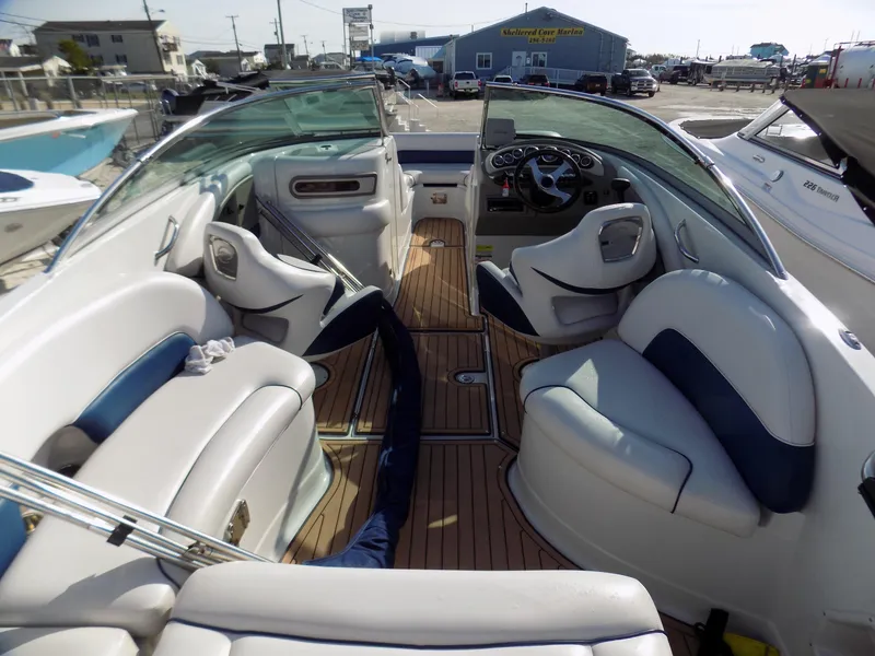 Slide: The Image of 2013 Crownline Eclipse E4 boat interior with plush seating and sleek dashboard. - 3