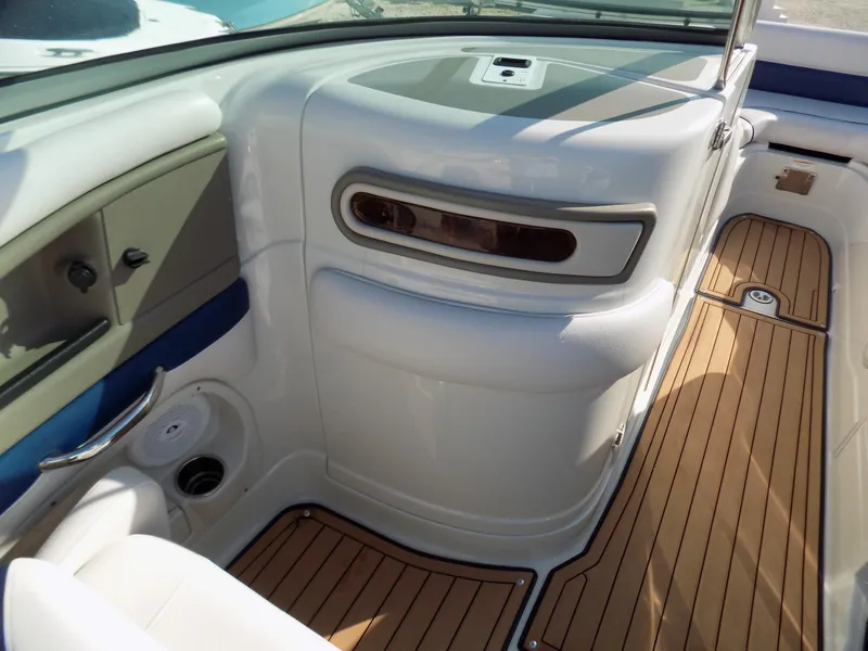 Slide: The Image of 2013 Crownline Eclipse E4 boat interior with sleek design and wood-textured flooring. - 5
