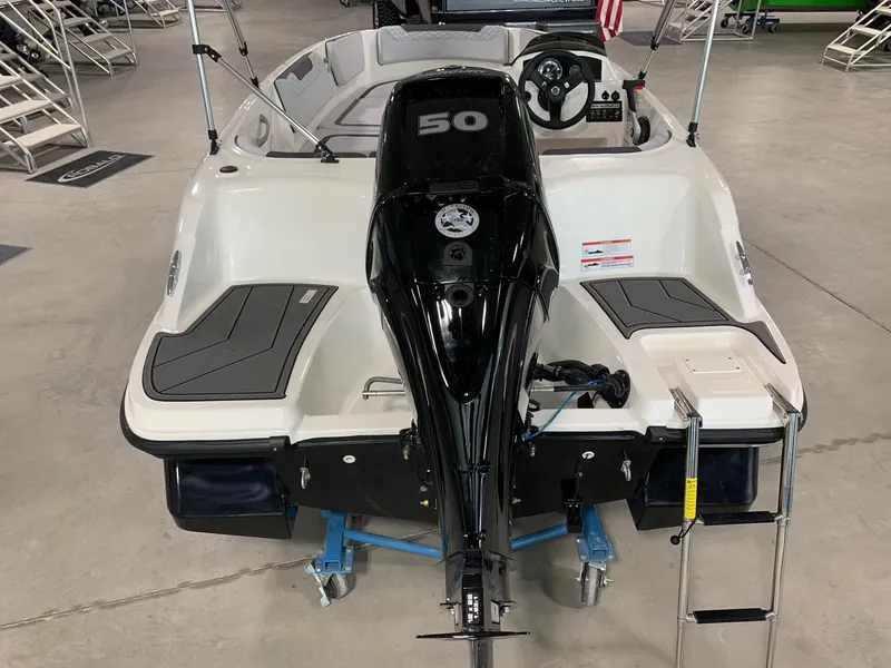 Slide: The Image of 2024 Bayliner Element M15 boat with 50 HP outboard motor, rear view. - 2